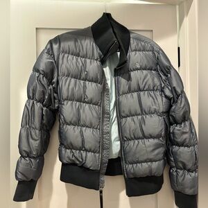 The North face women’s bomber jacket size medium. Color is a blue/silver.